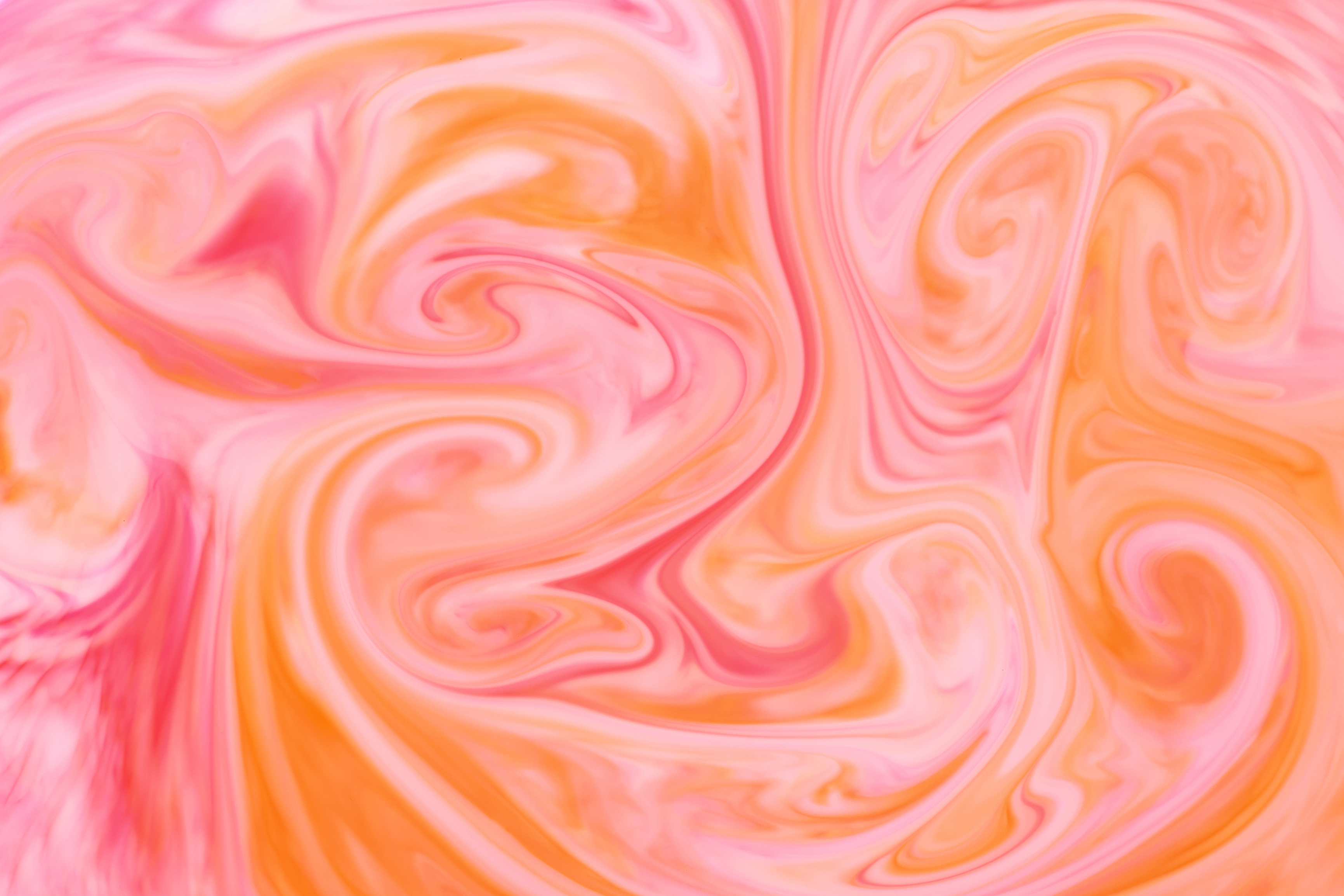  Swirling of  Blended Orange and Pink Ink